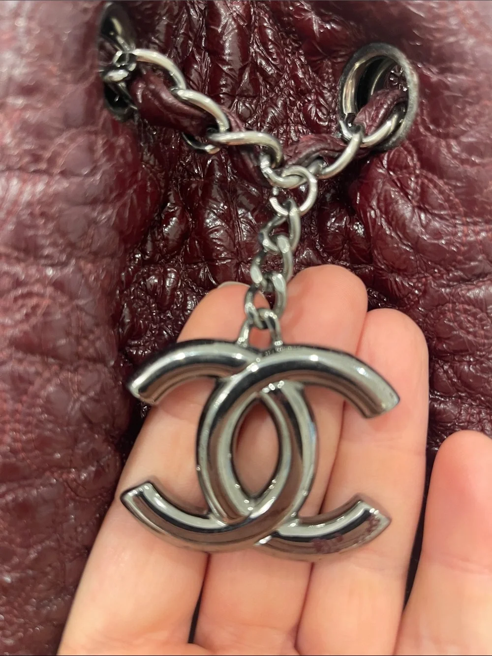Authentic CHANEL Camelia in Bordeaux with CC Charm